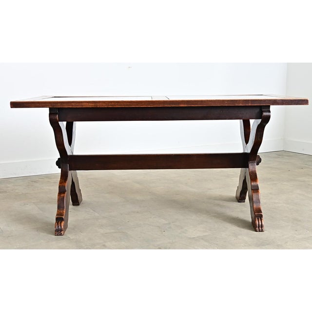 Italian late 19th century oak trestle table with two large inset marble tiles in the surface as a decorative and yet...