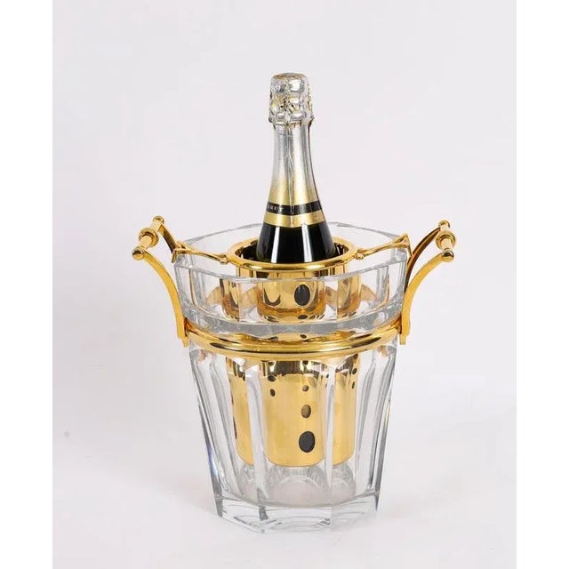 A fabulous Baccarat 'Harcourt' crystal and gold-plated champagne cooler, dating from the 1970s. The tapering octagonal...