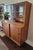 This 1950s Scandinavian teak china cabinet combines elegant modern design with a lower, square profile that fits...