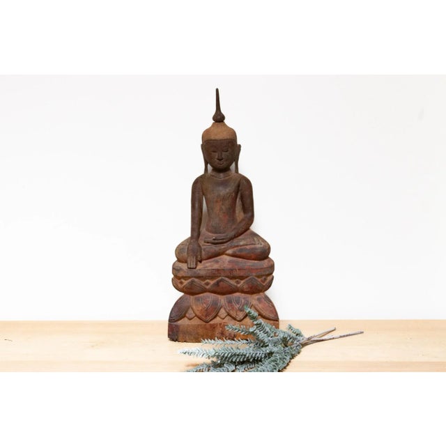 Discover the elegance of our tall antique Thai Buddha statue, a remarkable wood carving found in Thailand. This exquisite...