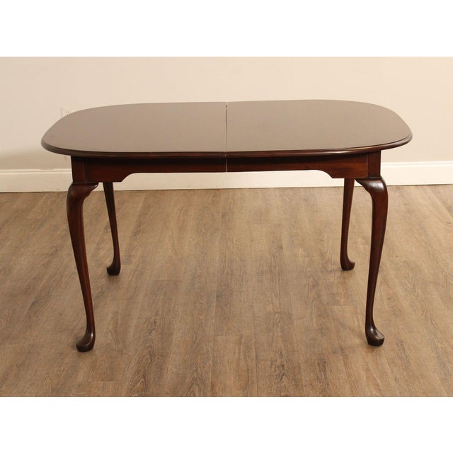 High Quality American Made Queen Anne Style Dining Table Constructed Of Solid Cherry. Features A Shaped Rectangular Top...