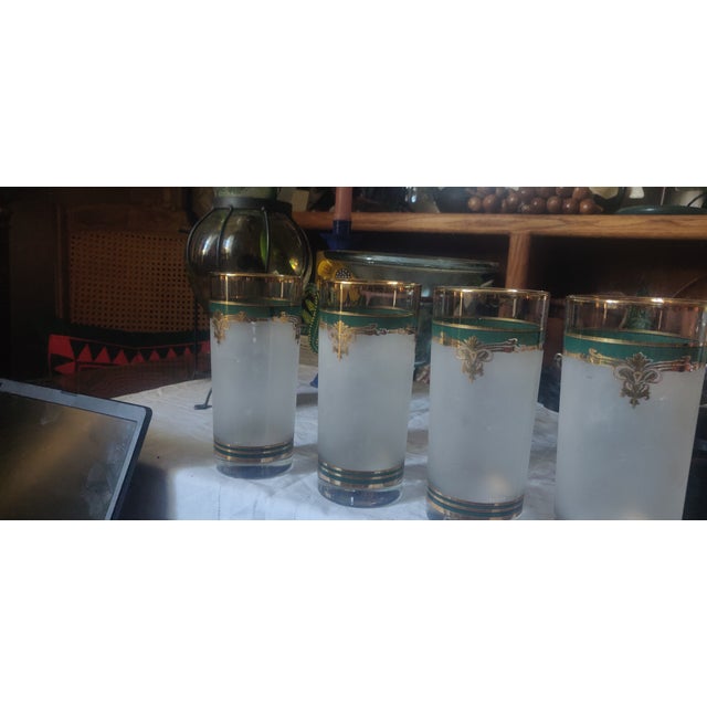 Used CULVER vintage tall tumblers. Perfect addition to a stylish bar and table setting! Set of four, gold rim and green...