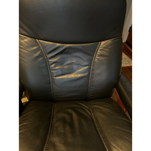 Classic Ekornes Stressless Consul recliner with matching ottoman, made in Norway. Features the signature Stressless...