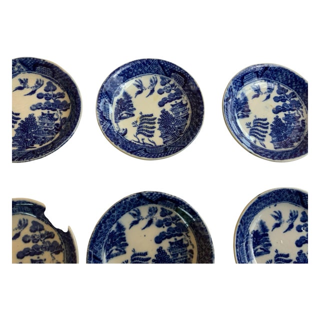 The "E.G.& J.E.." marking is a backstamp found on Blue Willow china, specifically identifying pieces made in England by...
