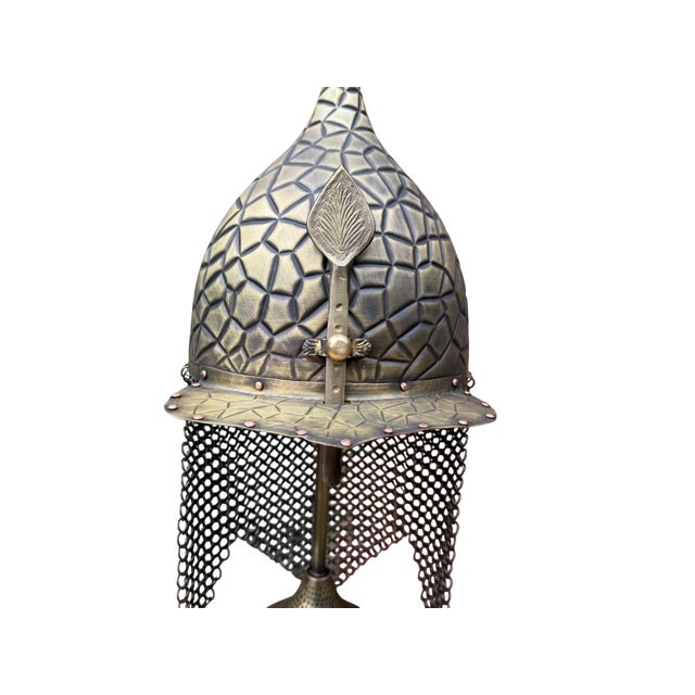 A commanding artifact of historical martial design, this heavy brass turban helmet is crafted as a sophisticated tabletop...