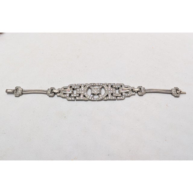 Circa 1930s art deco pot metal clear round, keystone and baguette rhinestones openwork bracelet with 2 rolled mesh strands...
