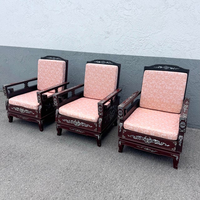 A refined expression of traditional Chinese craftsmanship, this set of three rosewood lounge chairs showcases exquisite...