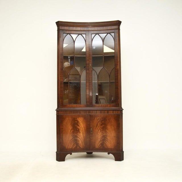 A very impressive antique Georgian style concave corner cabinet. This was made in England, we would date it to around the...