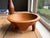 Beautiful hand-carved wooden bowl featuring a sculptural four-leg base and warm natural grain throughout. Crafted from...