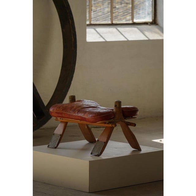 This 20th-century upholstered footstool originates from North Africa, Morocco, and reflects the region’s long tradition of...