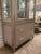 Stylish Pulaski Furniture Champagne Display Cabinet. Acrylic handles, 2 drawers, 3 glass shelves, mirrored back and touch...