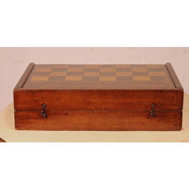 Lovely 19th-century walnut and boxwood game box A very beautiful and unusual box featuring light wood inlays forming a...