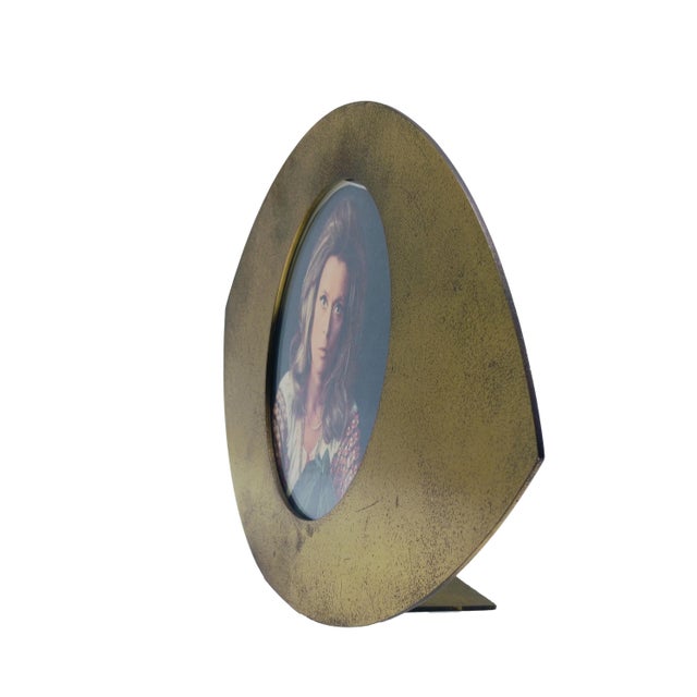 Extremely rare solid brass photo frame from the Ellisse series designed by Gabriella Crespi in the 1970s. Signature...