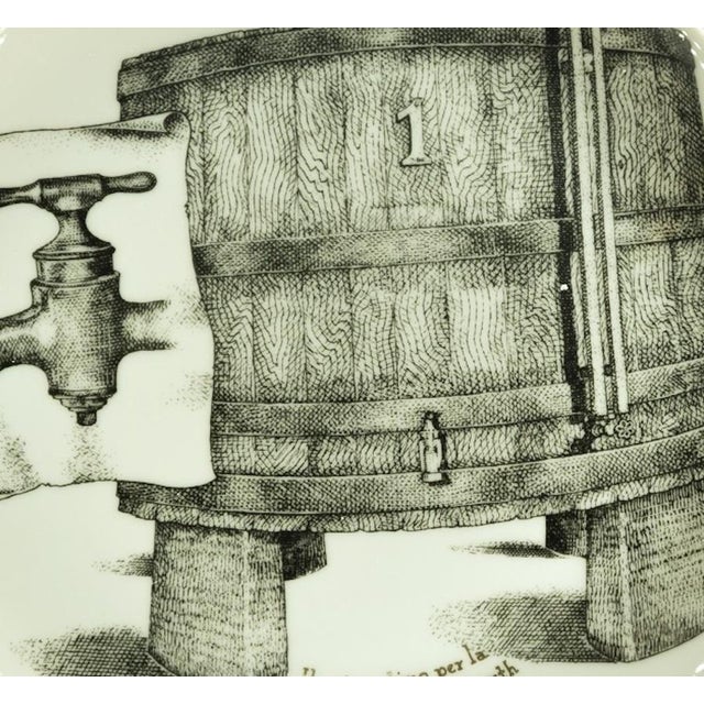 Il Primo Tino, for Martini & Rossi is a silk-screened porcelain plate, designed by Piero Fornasetti for Martini & Rossi in...