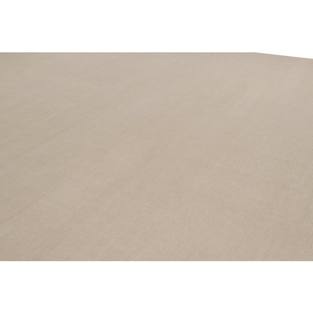 Hand-knotted in wool and cashmere, this 10x16 contemporary rug is the newest addition to the Rug & Kilim Textural...