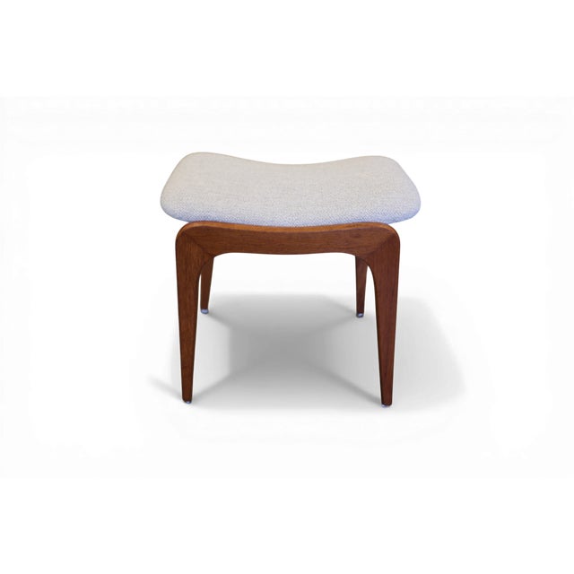 A beautiful Danish stool in teak, shaped with the soft and sweeping lines that characterize Scandinavian design from the...