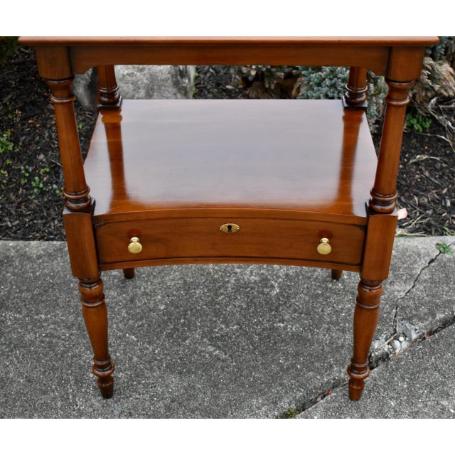 Vintage (1980's) Side Table has an Americana Style. Made by Statton Furniture. The Wood is CherryWood. One Drawer w/Brass...