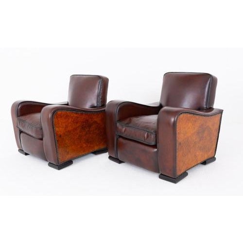 Impressive pair of Art Deco walnut and leather club chairs Classic Art Deco design with bold geometric form Period art...