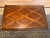 Rectangular coffee table with a lattice parquetry top inside a raised molded border, rounded flame mahogany apron, and...