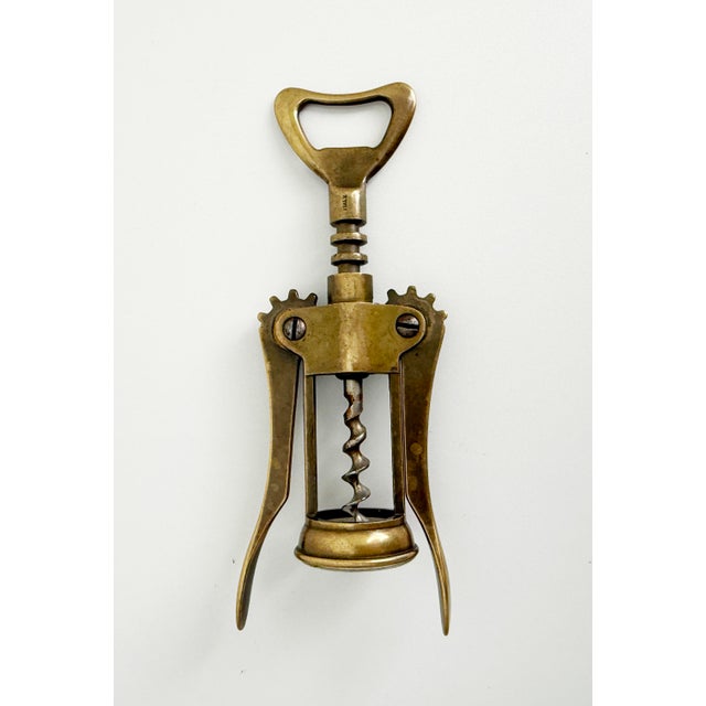 Classic, Italian-made brass corkscrew featuring an unlacquered finish with rich patina. Operates smoothly, fully...