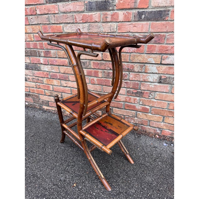 A wonderful 19th Century english bamboo plant stand/ side table. In addition to being a plant stand, it is also a side...