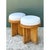 This pair of vintage rattan drum stools showcases a clean, cylindrical silhouette characteristic of mid-century tropical...
