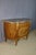 A louis xvi style half-moon commode with doors, dating from the second half of the 20th century. This commode bears the...