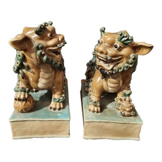 Vintage Shiwan Kiln Amber Glazed Foo Dogs on Pedestals - A Pair For Sale
