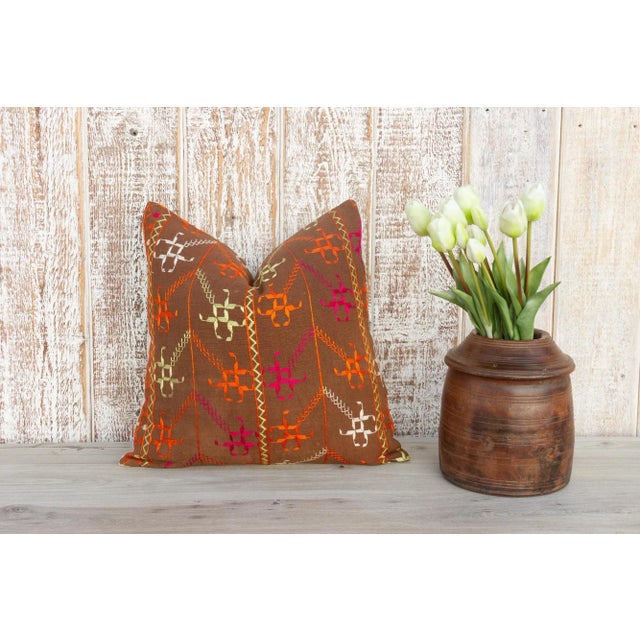 This colorful and luxurious Bagh Phulkari pillow features beautiful hand-done silk embroidery on top of a cotton fabric....