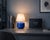 Crafted with high visual clarity, this modern table lamp features a sleek silhouette with a hand-blown glass base paired...