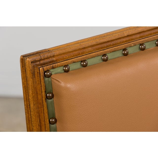 A refined set of six late 19th century French Louis XVI style dining chairs sourced in Paris, France. Hand-crafted from...