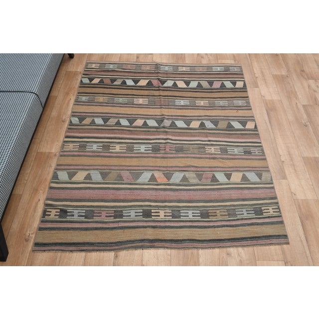 Vintage Turkish Hand-Knotted vintage rug is a semi-antique vintage area rug. The '70s Eastern region of Turkey's unique...