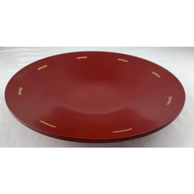 Vintage Japanese red lacquer decorative bowl with gold geometrical circumference design motif.