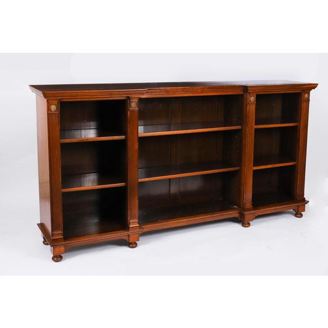This is a beautiful antique Victorian solid walnut open breakfront dwarf bookcase, circa 1860 in date. It is fitted with...