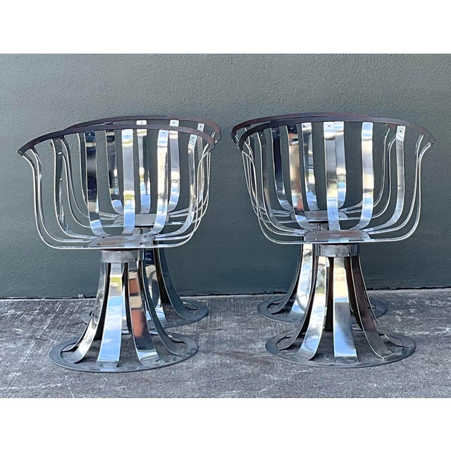 Make a bold statement with this rare set of four mid-century modern swivel chairs, designed by the visionary Herbert...