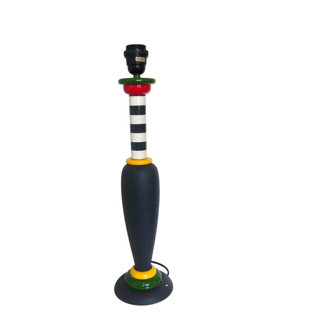 An exceptional and very rare table lamp from the Memphis era. This postmodern lamp was made by Olivier Villatte. The lamp...