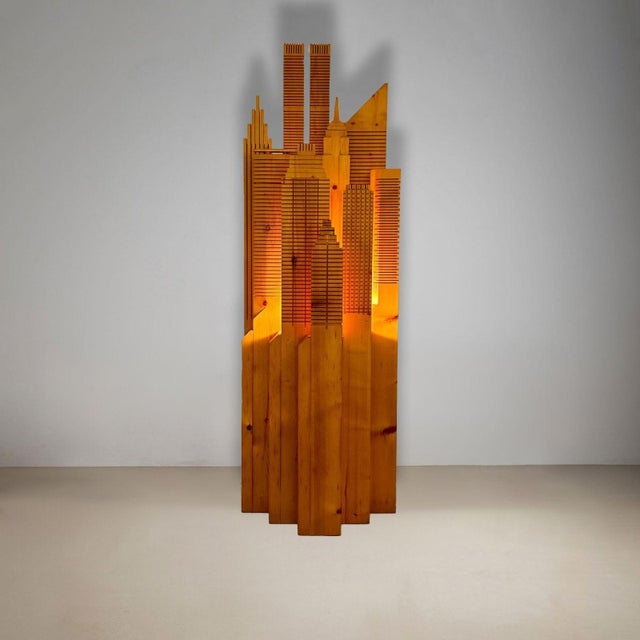 This dramatic and charming illuminated floor sculpture is carved of solid pine and features the famous buildings from the...