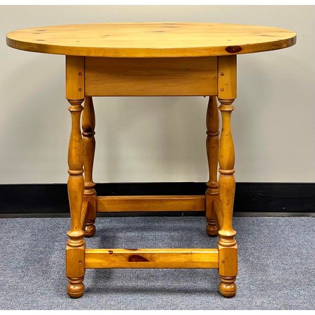 This vintage Lane Furniture "Museum of American Folk Art" collection side table is a beautifully crafted piece from the...