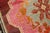A wild 20th century Turkish Kars square size rug. A large scale floral design featuring a bright pink medallion with a...