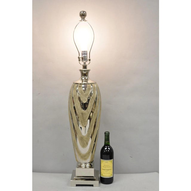Contemporary Modern Silver & Gold Ceramic "Allegheny" Table Lamp by Uttermost. Item Features Textured Ceramic Finished In...