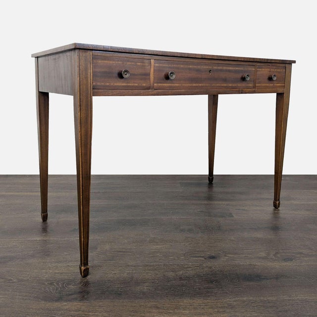 Circa 1790 refined neoclassical table with inlay and elements of reeded edge top, featuring three drawers with dovetail...