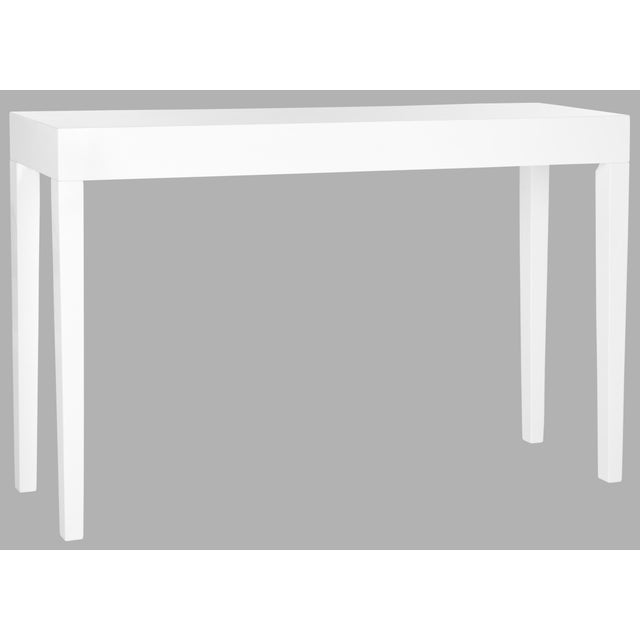 The classic Parsons table gets a chic update with slightly tapered legs in the crisp white lacquer console.Use this piece...