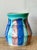 Introduce a splash of vibrant mid-century color to your decor with this charming vintage vase by Hull Pottery....
