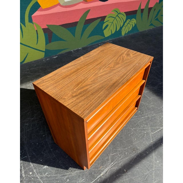 Perfect example of mid century design - walnut, clean lines, sculpted pulls, even a formica top for that extra resiliency....