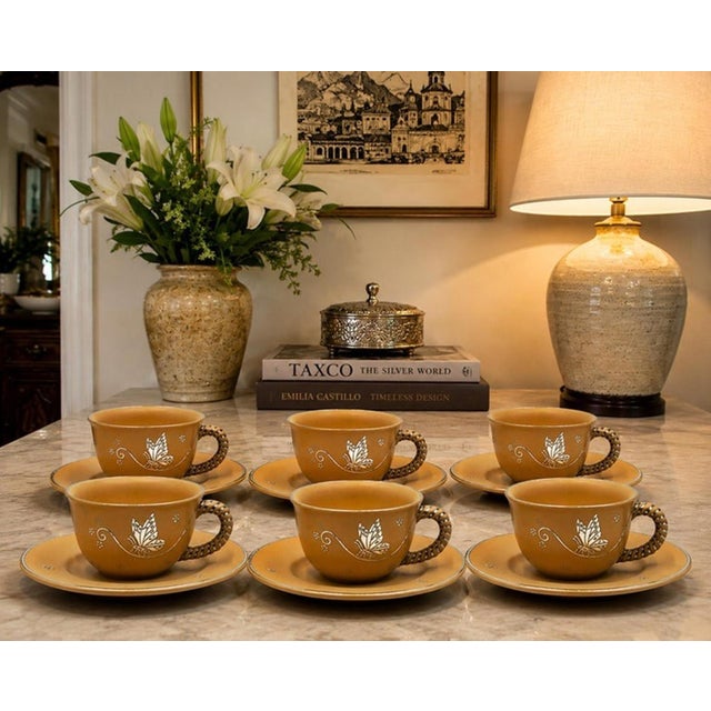 Charming and highly collectible set of six porcelain cup and saucer sets designed and handcrafted in Taxco, Mexico by...