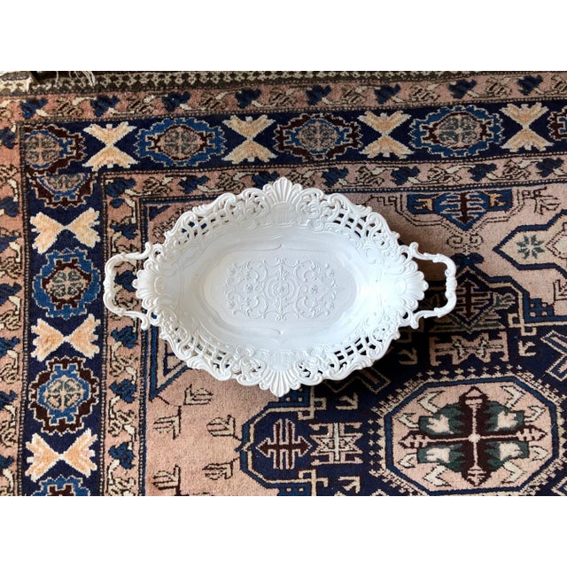 White enamel pierced metal basket with handles Made in Italy.