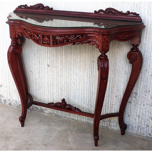About 20th century fancy Rococo style Italian carved mahogany and glass and marquetry top console. Details PRODUCTION TIME...