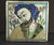 An impressive early glazed earthenware tile Masterly painted underglaze portrait of a man in traditional attire, looking...