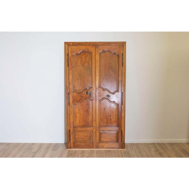 This pair of 18th-century French communication doors, masterfully crafted from walnut, showcases the wood’s natural warmth...