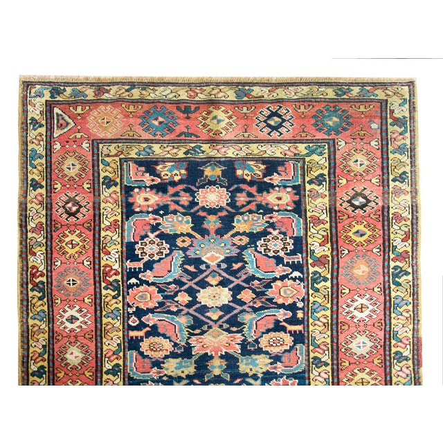 A stunning early 20th century Persian Azari runner with an all-over floral lattice pattern with myriad flowers and...